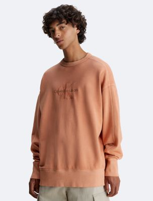 Calvin Klein Oversized Embossed Logo Crewneck Sweatshirt in Red