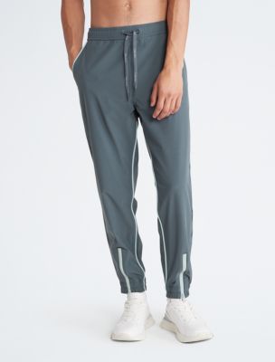 Calvin Klein Men's Slim Fit Stretch Wicking Sport Tech Zip Pocket Jogger  Pants