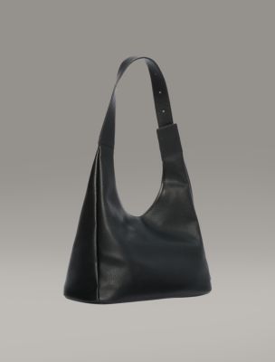 Calvin Klein Women's Elemental Curve Shoulder Bag in Black | Imported