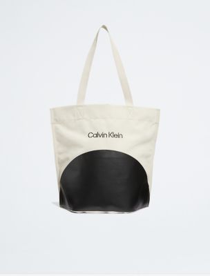 Buy the Calvin Klein White and Beige Canvas Tote Bag