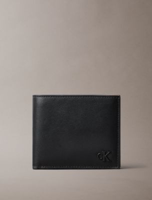 Мужской кошелёк Calvin Klein Suede Monogram Bifold Wallet with Coin Pouch, цвет: Чёрный — фото 1