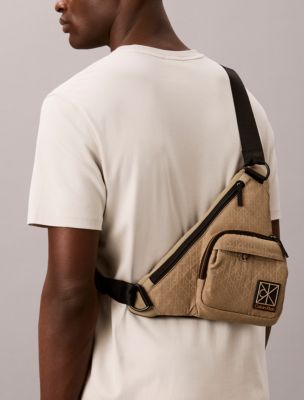 Мужская сумка Calvin Klein Allover Emblem Logo Utility Sling, цвет: Кешью — фото 4