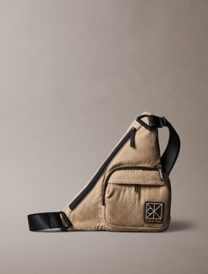 Мужская сумка Calvin Klein Allover Emblem Logo Utility Sling, цвет: Кешью — фото 1