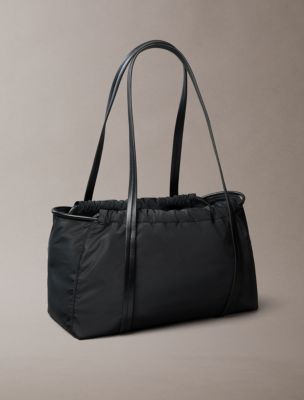 Женские сумки Calvin Klein Embossed Monologo Satchel — фото 2