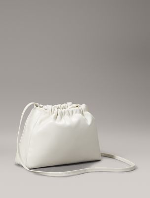 ハンドバッグ   Women's CKJ Drawstring Shoulder Bag Ivory 4K302 Monogram Logo Drawstring Crossbody Bag | Calvin Klein