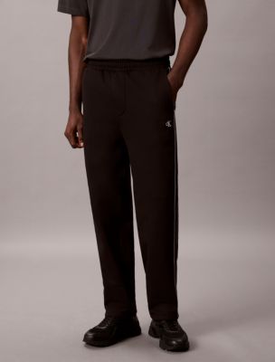 Мужские брюки Calvin Klein Logo Tape Fleece Sweatpants — фото 2