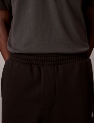 Мужские брюки Calvin Klein Logo Tape Fleece Sweatpants — фото 3