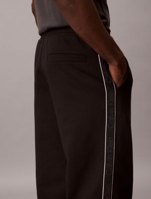 Мужские брюки Calvin Klein Logo Tape Fleece Sweatpants — фото 5