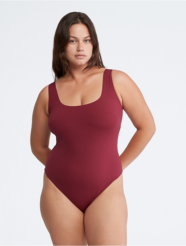 Calvin Klein - The one-piece suit. Coral Kwayie wearing the Intense Power  Scoopneck Swimsuit. Made with 78% sustainably-sourced recycled nylon.  Finished with a bold logo on the chest, signature logo straps, and